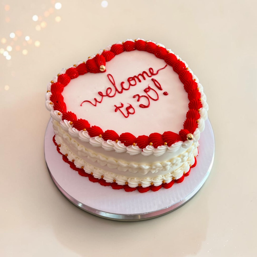 White Heart shaped cake with Red borders