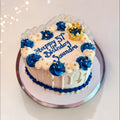White and Navy Blue Heart shaped cake