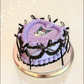 Purple with Black ribbons Heart shaped cake