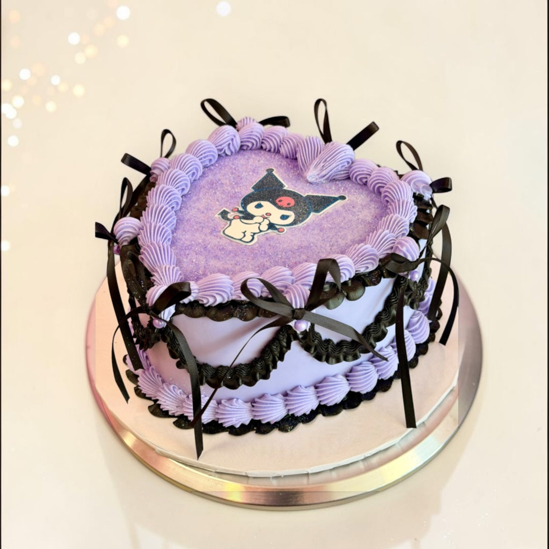 Purple with Black ribbons Heart shaped cake